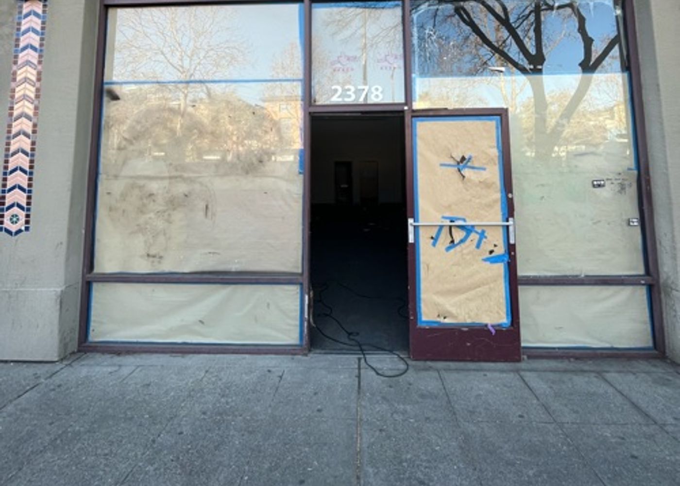 Abandoned boarded up shop 1