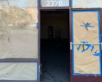 Abandoned boarded up shop 2
