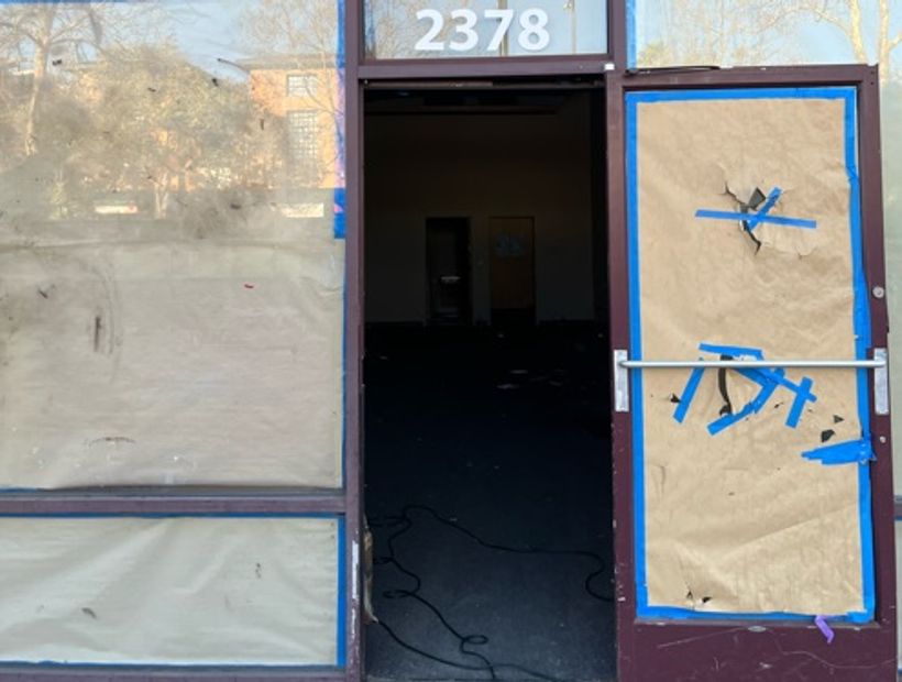 Abandoned boarded up shop 2